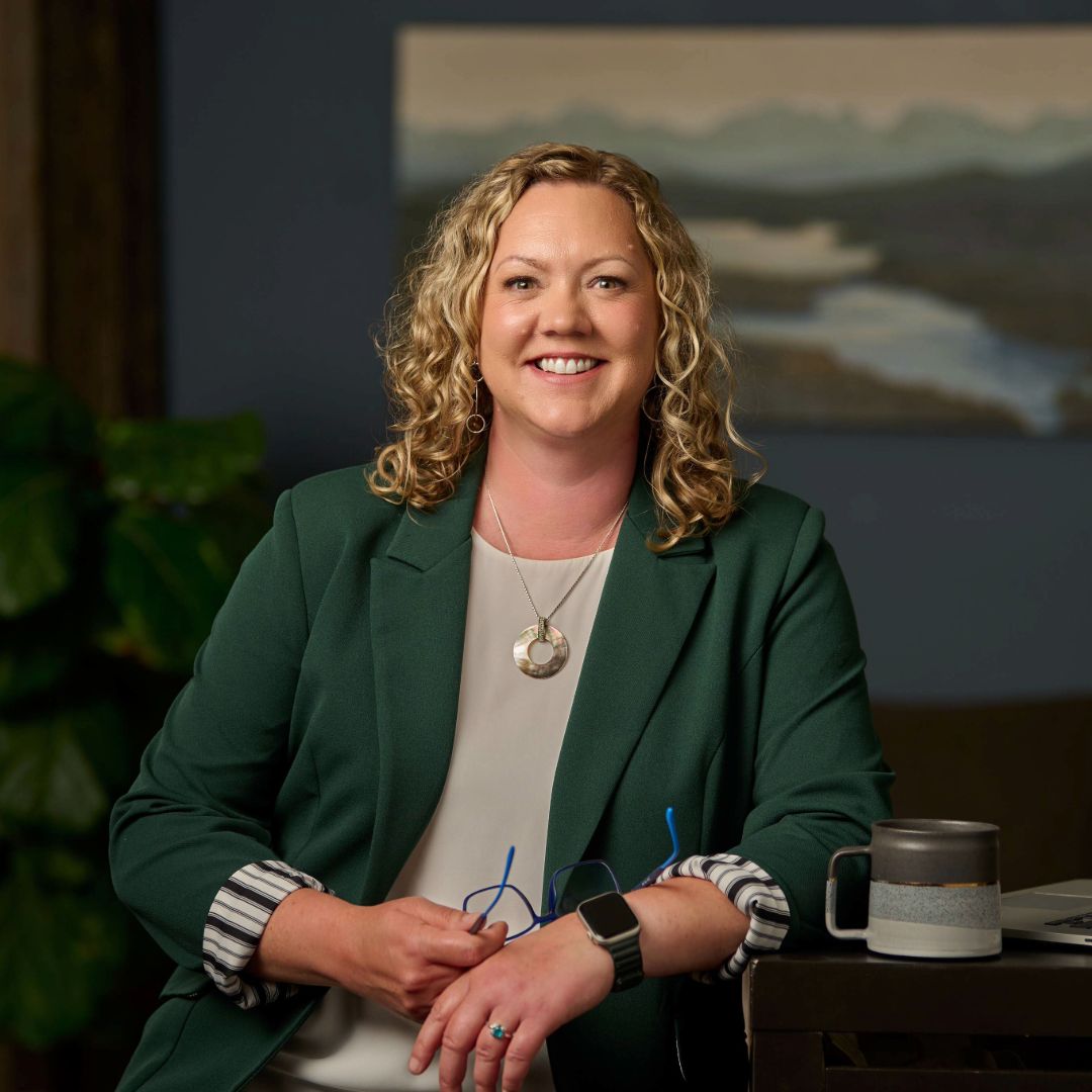 Karen Phenix, founder of Phenix Momentum, smiling at the camera