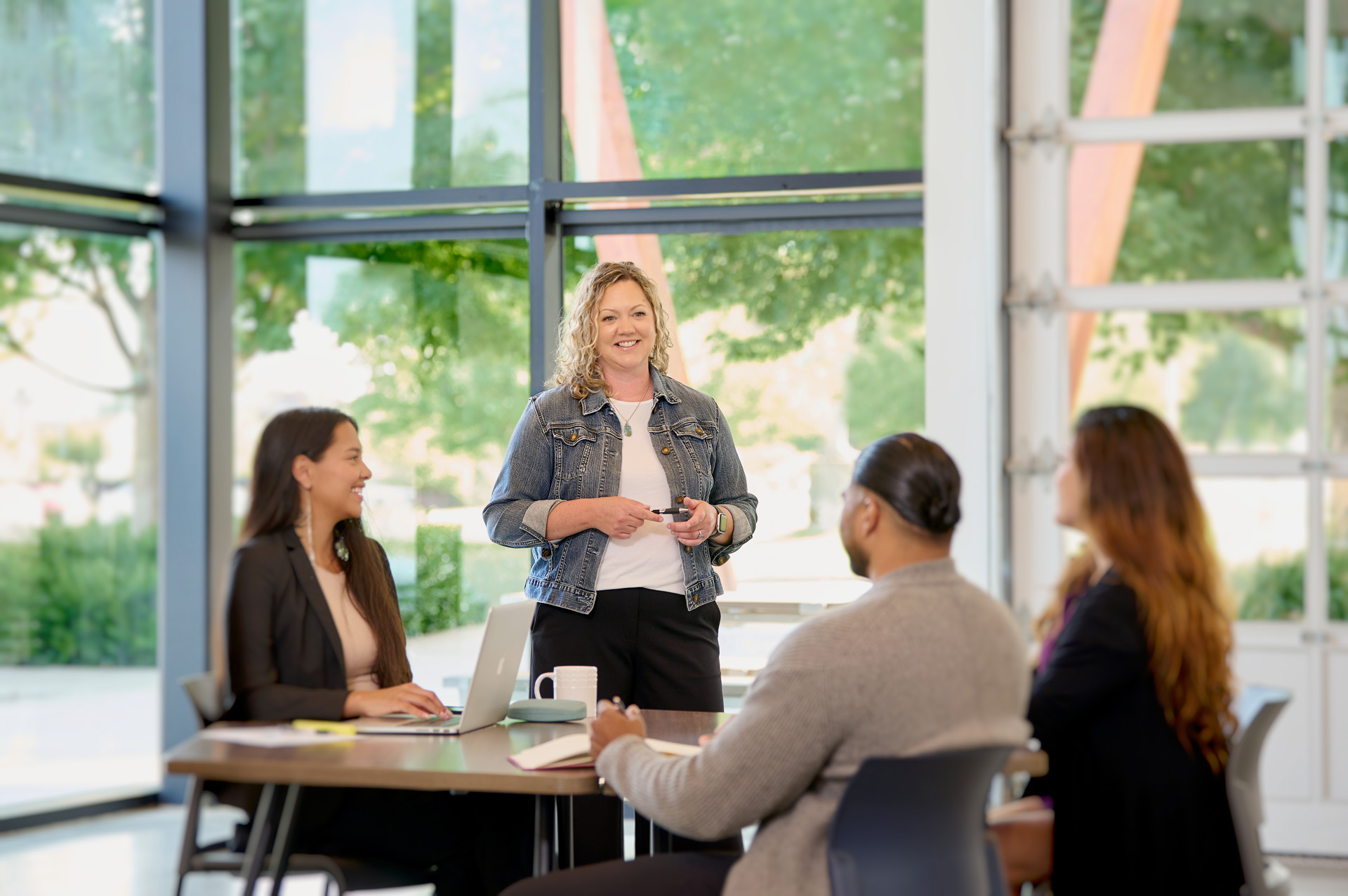 Karen working with a team of people
